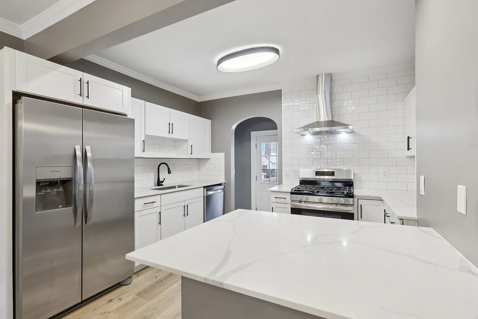 Bright kitchen with updated cabinetry and fixtures